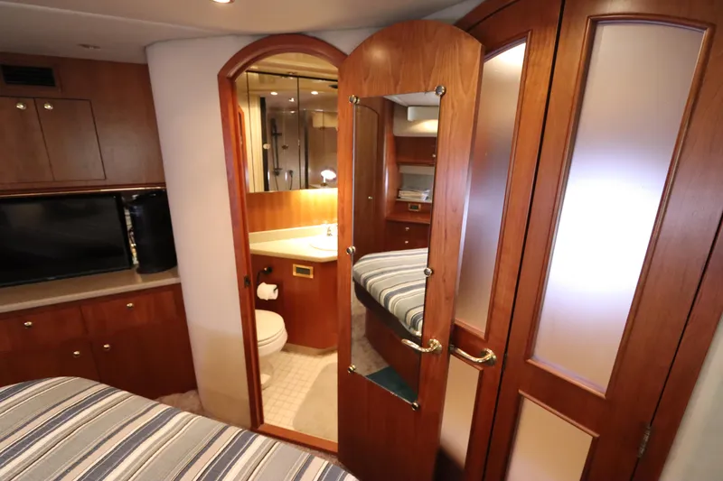 Slide: The Image of Interior of 2000 Cruisers Yachts 4450 Express Motoryacht with wood cabinetry and bathroom. - 47