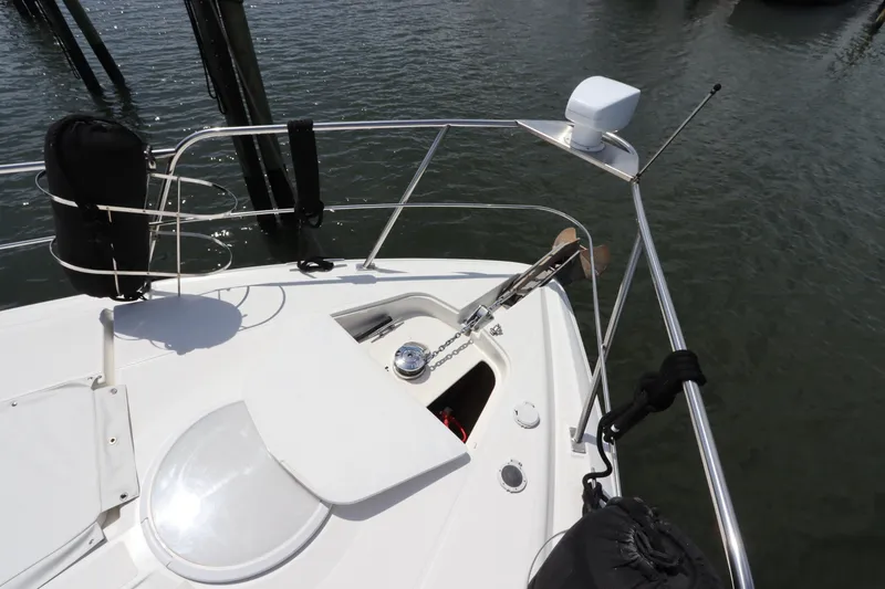 Slide: The Image of Bow of 2000 Cruisers Yachts 4450 Express Motoryacht with anchor and railing. - 5