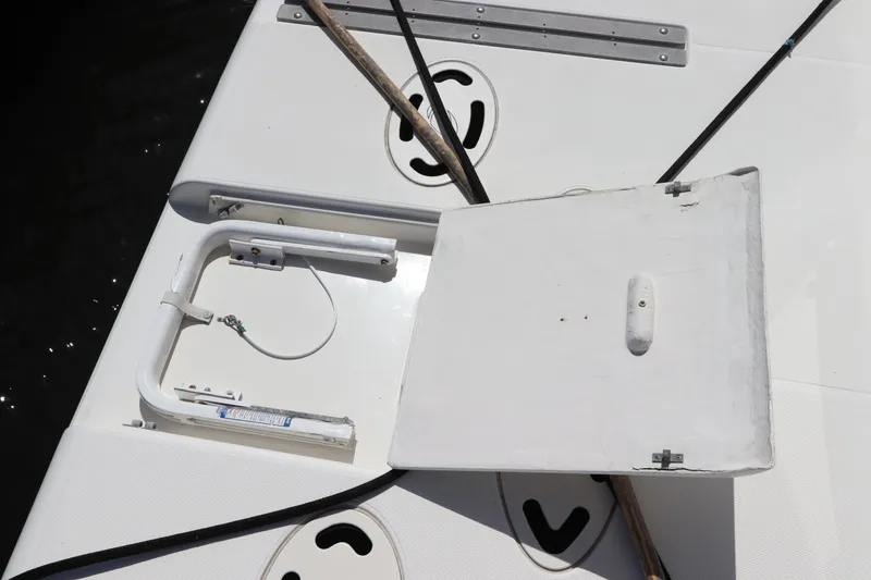 Slide: The Image of 2000 Cruisers Yachts 4450 Express Motoryacht deck hatch with open cover and fittings. - 8