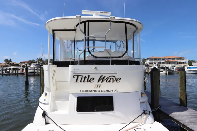 Slide: The Image of 2000 Cruisers Yachts 4450 Express Motoryacht docked at marina, Hernando Beach, FL. - 9