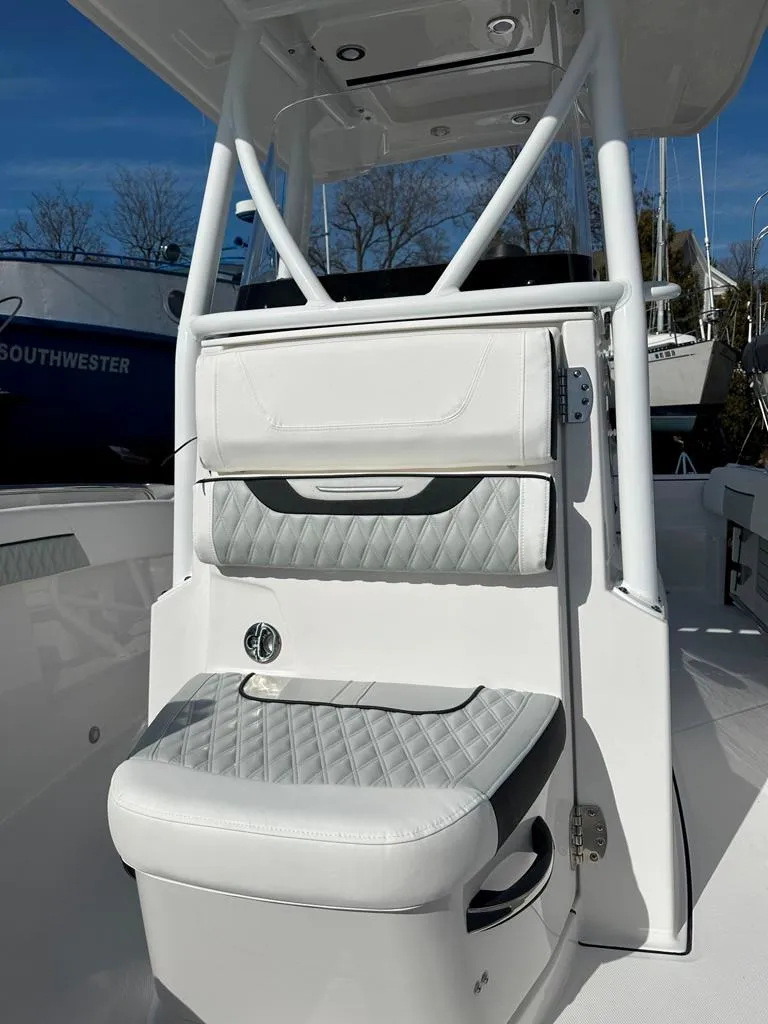 Slide: The Image of 2024 Blackfin 222CC boat interior with cushioned seating and sleek design. - 29