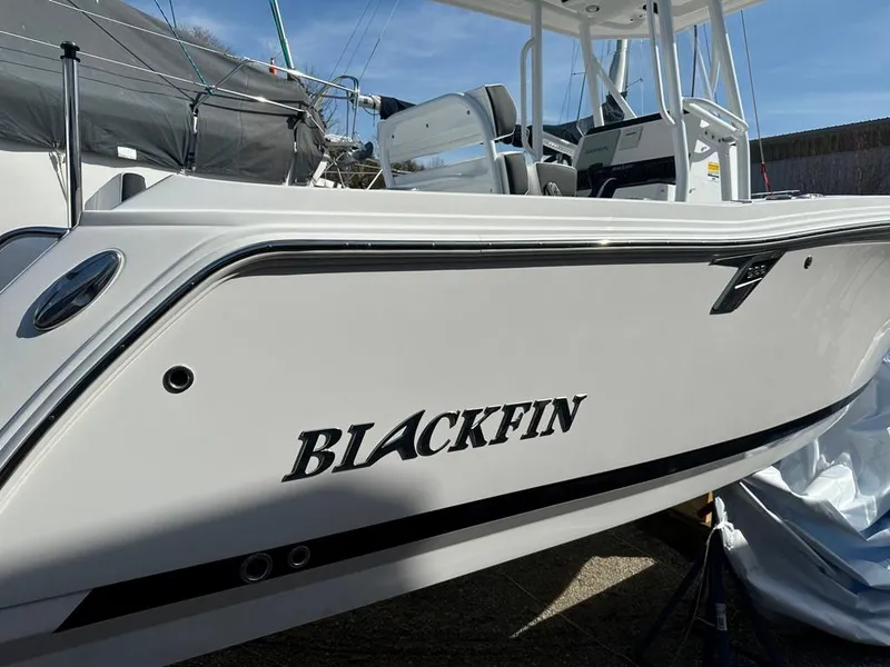 Slide: The Image of 2024 Blackfin 222CC boat, side view, showcasing sleek design and branding. - 4