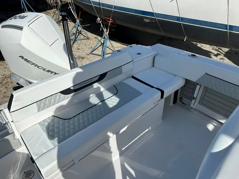 Slide: The Image of 2024 Blackfin 222CC boat interior with seating and Mercury engine. - 9