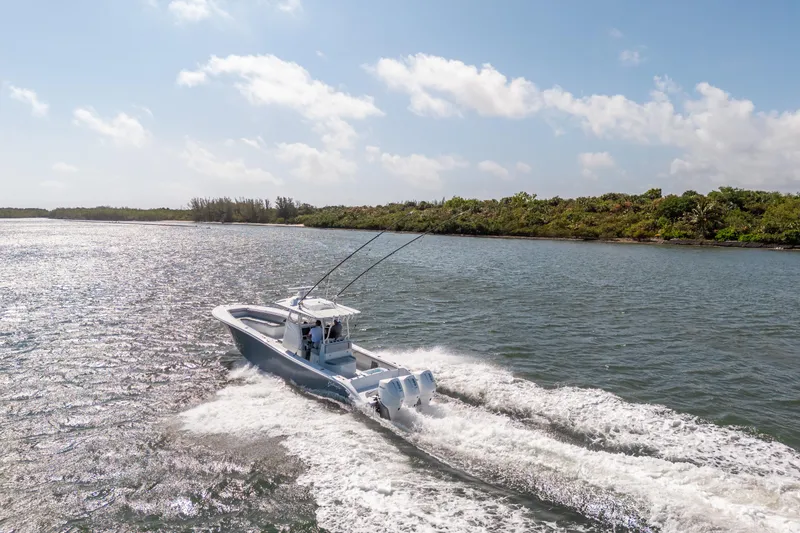 Slide: The Image of 2023 Yellowfin 36 Center Console boat cruising on a sunny day. - 1