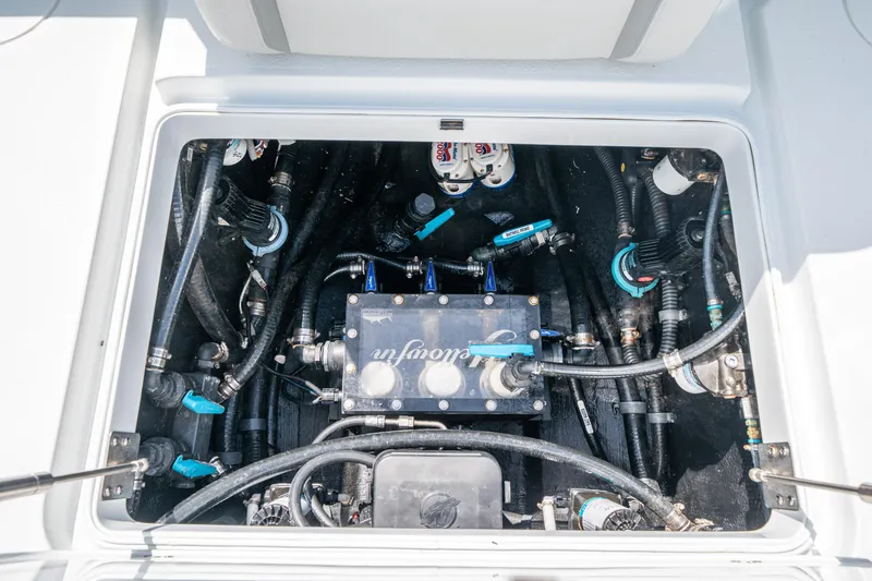Slide: The Image of 2023 Yellowfin 36 Center Console engine compartment with visible wiring and components. - 10