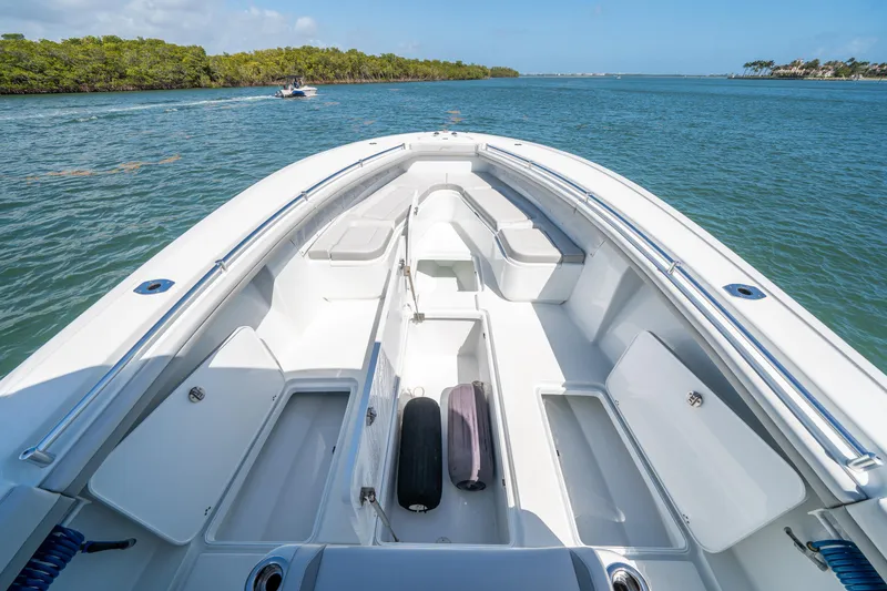 Slide: The Image of 2023 Yellowfin 36 Center Console boat on calm water, showcasing spacious deck and storage. - 11