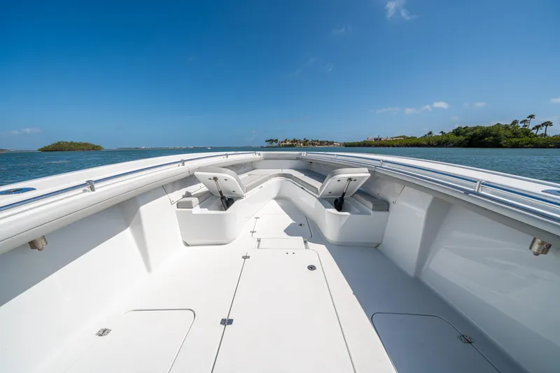 Slide: The Image of 2023 Yellowfin 36 Center Console boat on calm water, clear sky background. - 16