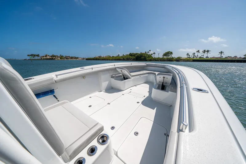 Slide: The Image of 2023 Yellowfin 36 Center Console boat on calm water under clear blue sky. - 17