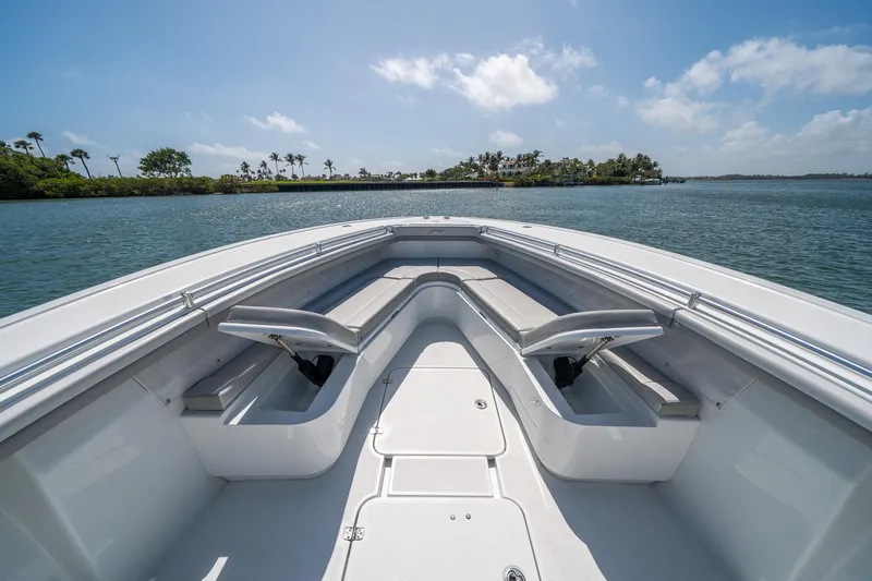 Slide: The Image of 2023 Yellowfin 36 Center Console boat on calm water, clear sky, island in background. - 18