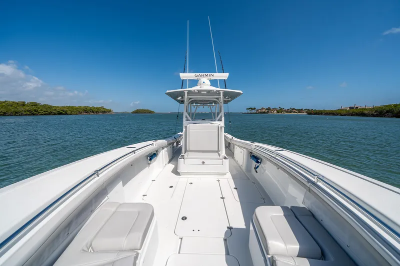 Slide: The Image of 2023 Yellowfin 36 Center Console boat on calm water under clear blue sky. - 19