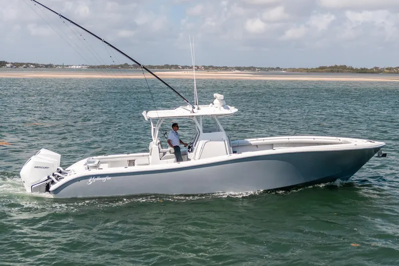 Slide: The Image of 2023 Yellowfin 36 Center Console boat cruising on open water. - 2