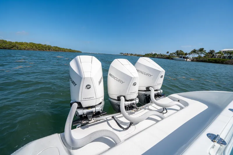 Slide: The Image of 2023 Yellowfin 36 Center Console with triple Mercury outboard engines on open water. - 5