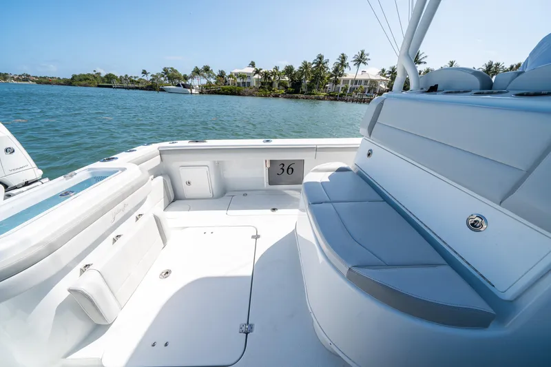 Slide: The Image of 2023 Yellowfin 36 Center Console boat interior with seating, on a sunny day by the water. - 6