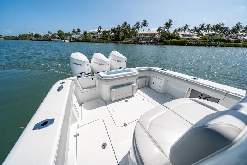 Slide: The Image of 2023 Yellowfin 36 Center Console boat on water with triple Mercury engines. - 7