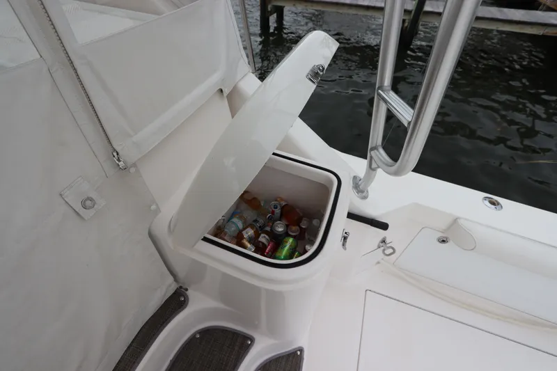 Slide: The Image of Built-in cooler on 2007 Cabo 40 Hardtop Express boat, filled with assorted drinks. - 18