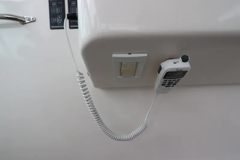 Slide: The Image of Control panel and radio handset on a 2007 Cabo 40 Hardtop Express yacht. - 30