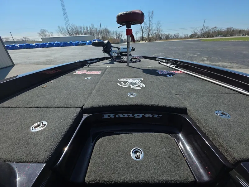 Slide: The Image of 2011 Ranger Z521 Comanche boat deck with fishing seat and storage compartments. - 9