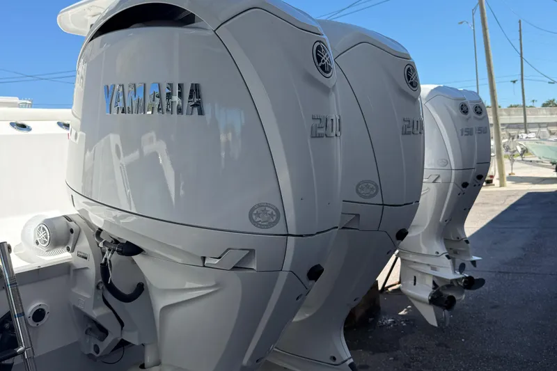 Slide: The Image of Yamaha outboard engines on a 2024 Tidewater 272 CC Adventure boat. - 13