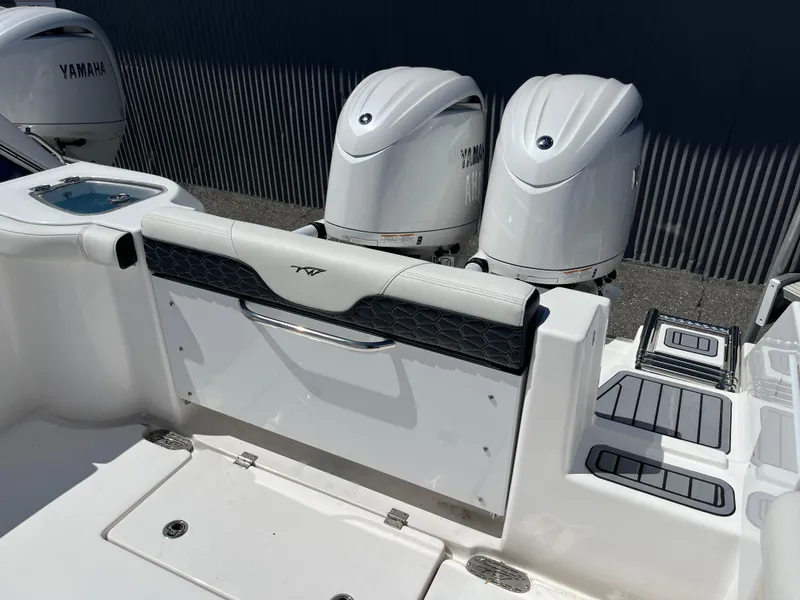 Slide: The Image of 2024 Tidewater 272 CC Adventure boat with dual Yamaha outboard engines. - 3