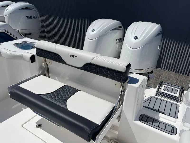 Slide: The Image of 2024 Tidewater 272 CC Adventure boat with Yamaha engines and stylish seating. - 4