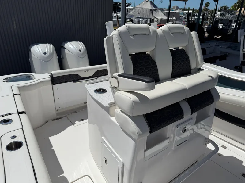Slide: The Image of 2024 Tidewater 272 CC Adventure boat with dual engines and luxurious seating. - 8