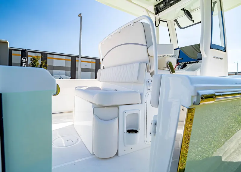 Slide: The Image of 2025 Sea Hunt Ultra 245 SE boat interior with white seating and modern design. - 12