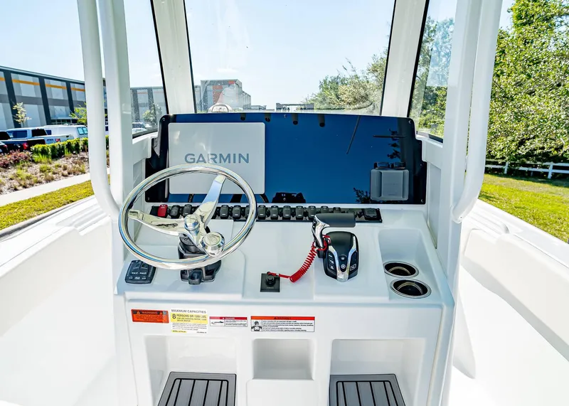 Slide: The Image of 2025 Sea Hunt Ultra 245 SE boat dashboard with Garmin navigation system. - 18