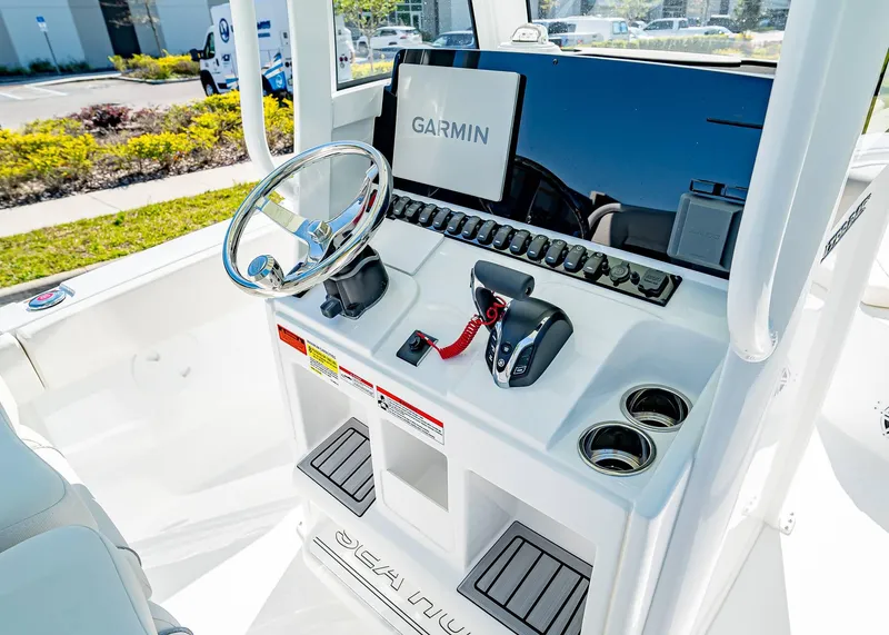 Slide: The Image of 2025 Sea Hunt Ultra 245 SE boat dashboard with Garmin navigation system. - 20