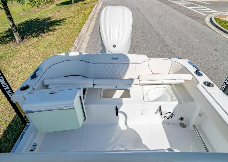 Slide: The Image of 2025 Sea Hunt Ultra 245 SE boat interior with seating and storage compartments. - 9