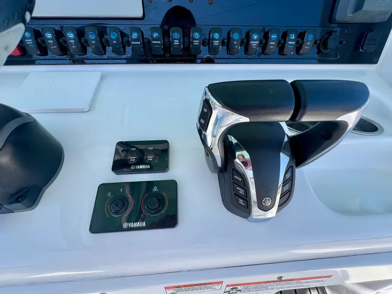 Slide: The Image of Control panel of 2023 Sea Hunt Ultra 265 SE boat with Yamaha throttle. - 14