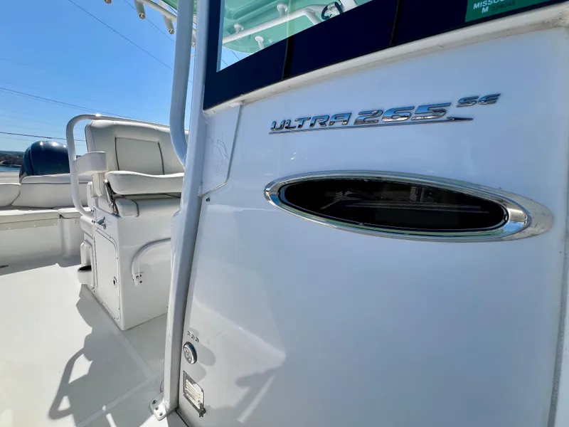 Slide: The Image of 2023 Sea Hunt Ultra 265 SE boat interior with seating and model emblem. - 20