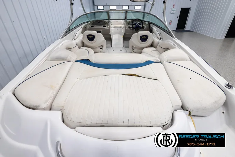 Slide: The Image of 2005 Crownline 216 LS boat interior with white seating and dashboard. - 12
