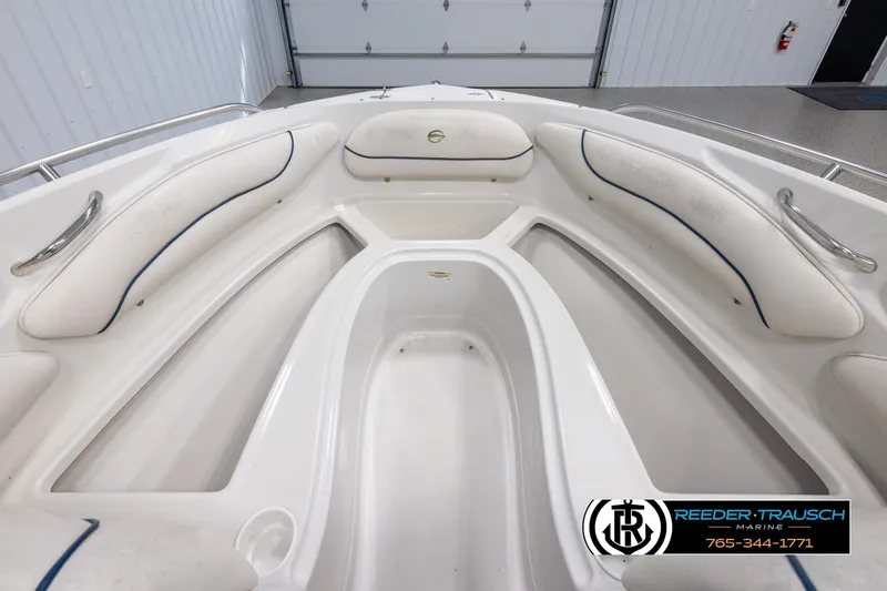 Slide: The Image of 2005 Crownline 216 LS boat interior with white cushioned seating and sleek design. - 15
