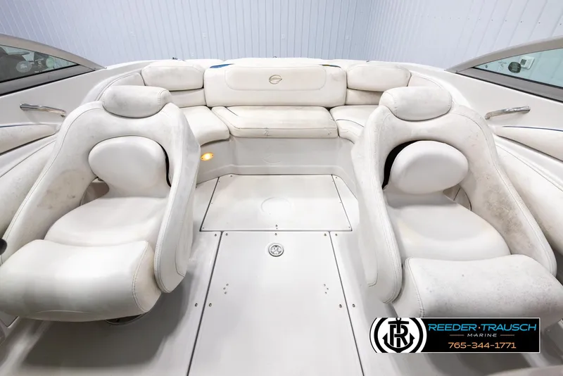 Slide: The Image of 2005 Crownline 216 LS boat interior with white seating and spacious layout. - 17