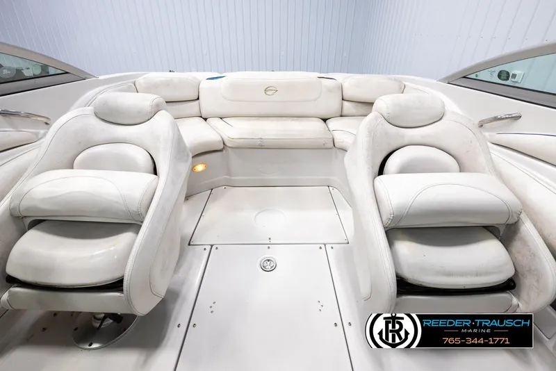 Slide: The Image of 2005 Crownline 216 LS boat interior with white seating and logo. - 18