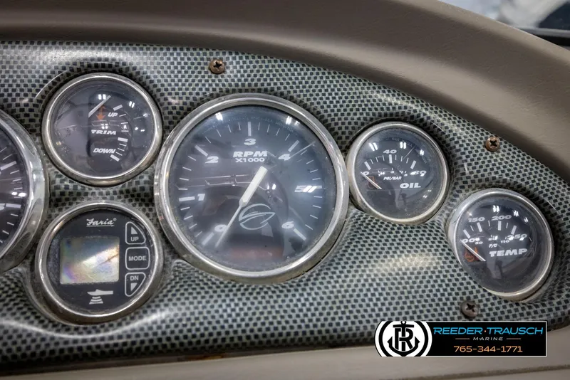 Slide: The Image of Dashboard of 2005 Crownline 216 LS boat with RPM, oil, and temperature gauges. - 28