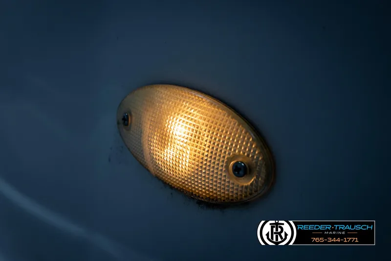 Slide: The Image of Close-up of a 2005 Crownline 216 LS boat light, glowing amber. - 37