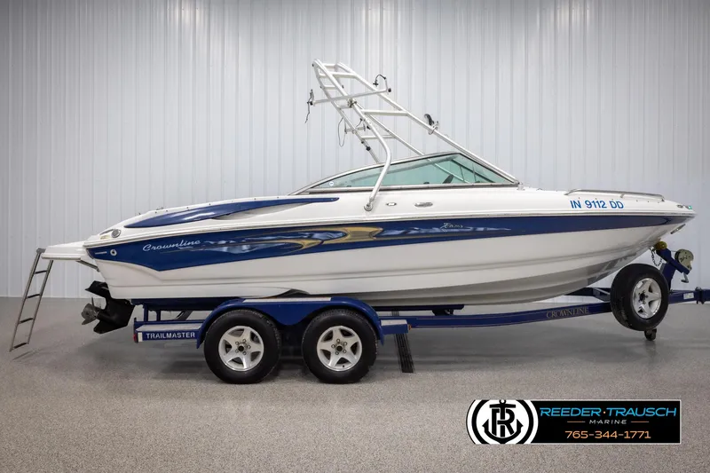 Slide: The Image of 2005 Crownline 216 LS boat on trailer in indoor showroom. - 4