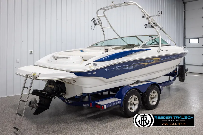 Slide: The Image of 2005 Crownline 216 LS boat on trailer in indoor showroom. - 5