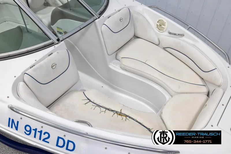 Slide: The Image of 2005 Crownline 216 LS boat interior with white seating and blue trim. - 8