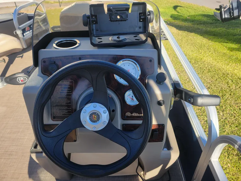 Slide: The Image of Steering console of 2023 Sun Tracker Bass Buggy 18 DLX pontoon boat. - 14