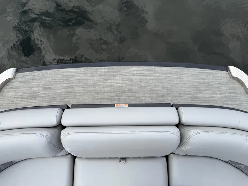 Slide: The Image of 2020 Bennington R 25 RFBWA Fastback boat with gray seating and deck, viewed from above. - 21