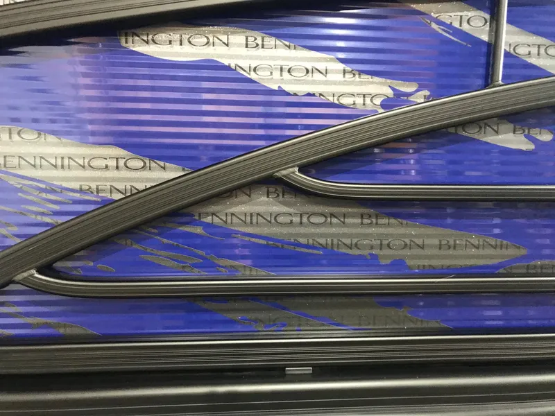 Slide: The Image of 2020 Bennington R 25 RFBWA Fastback with blue and black design details. - 5