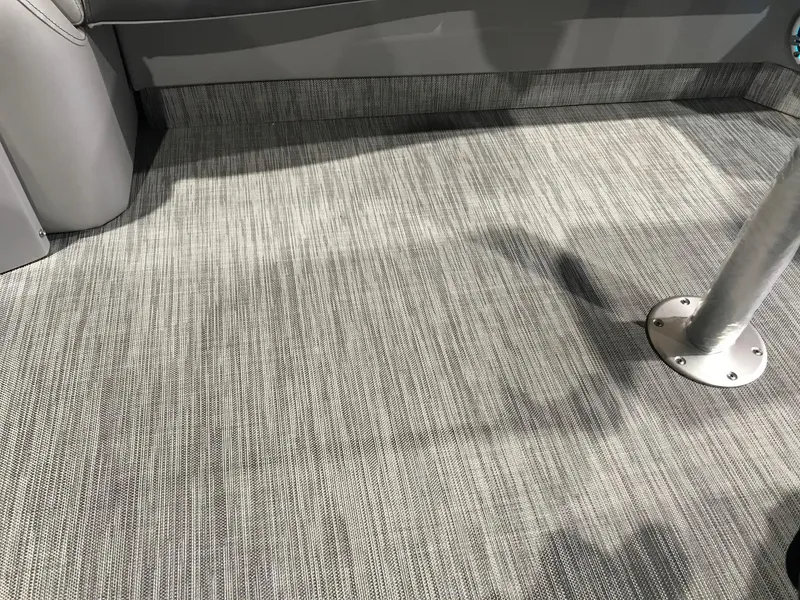 Slide: The Image of Gray woven flooring on a 2020 Bennington R 25 RFBWA Fastback boat interior. - 6