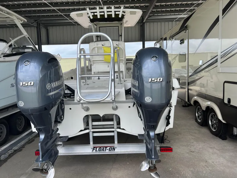 Slide: The Image of 2022 World Cat 235 CC boat with dual Yamaha 150 engines on a trailer. - 8