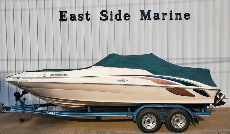 Slide: The Image of 1998 Sea Ray 210 Sundeck boat on trailer at East Side Marine. - 19