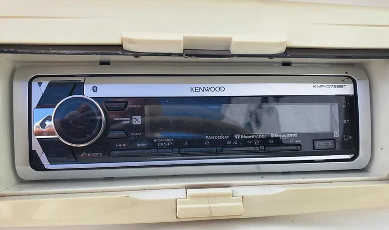 Slide: The Image of Kenwood stereo system in a 1998 Sea Ray 210 Sundeck boat dashboard. - 22