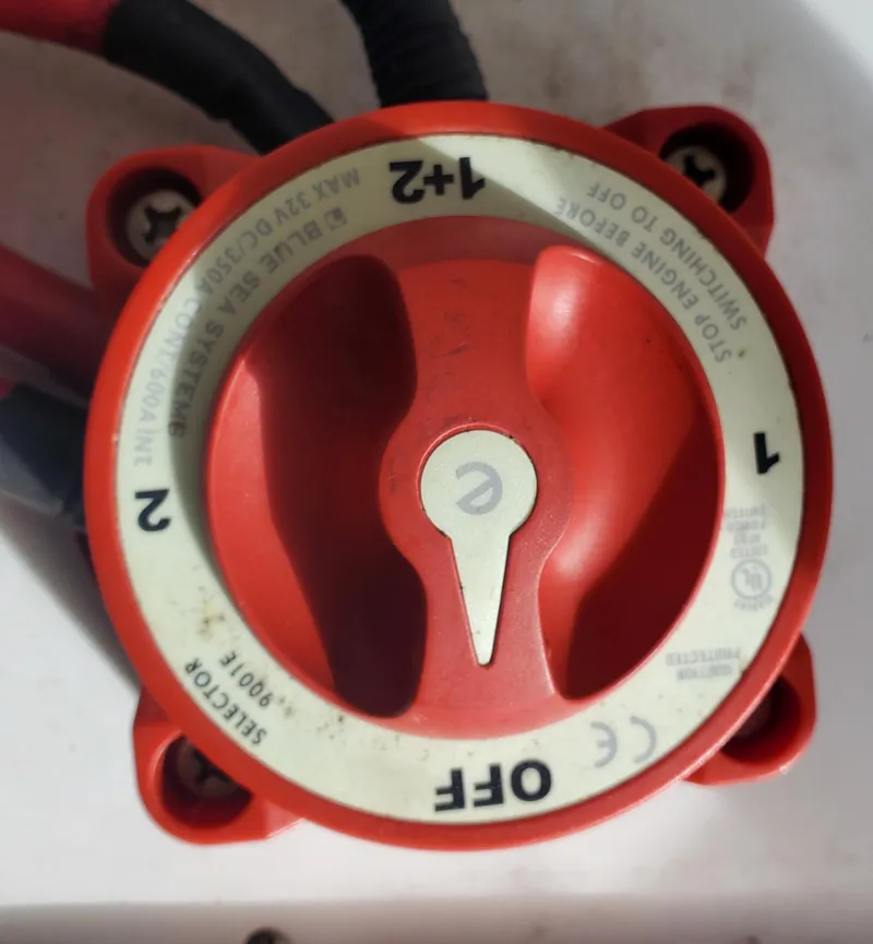 Slide: The Image of Red battery selector switch on a 1998 Sea Ray 210 Sundeck boat. - 25