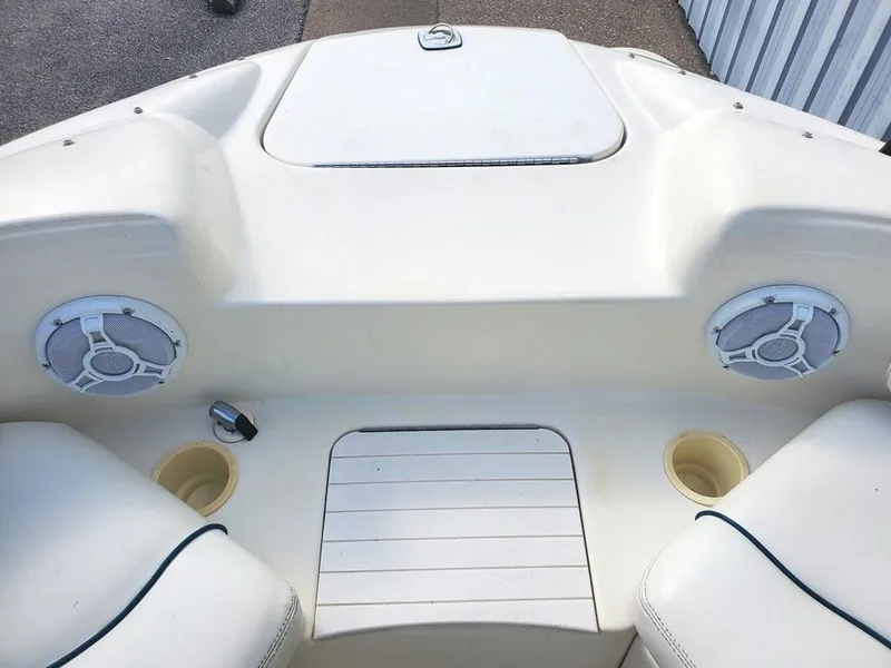 Slide: The Image of 1998 Sea Ray 210 Sundeck boat interior with speakers and cup holders. - 6