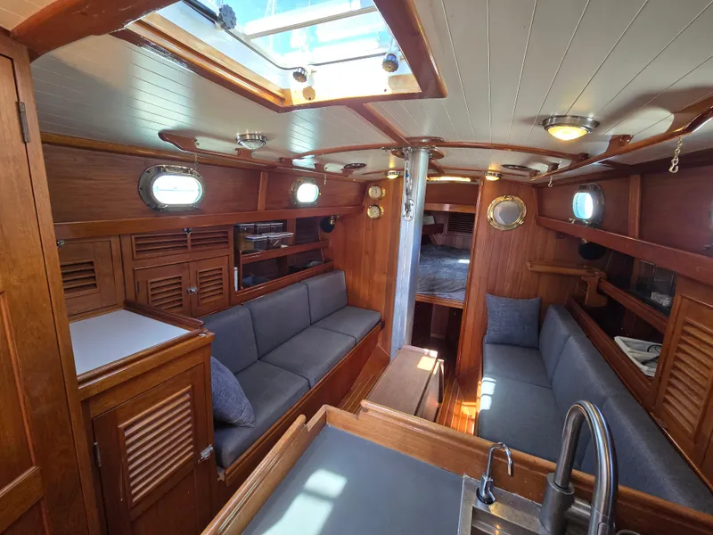 Slide: The Image of Interior of 1980 Shannon 38 PH sailboat with wooden finish and cozy seating area. - 15